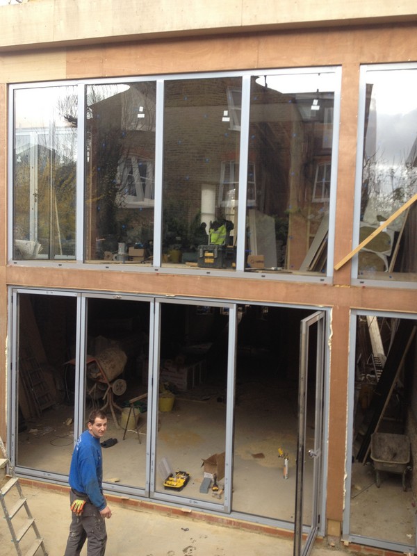 Aluminium bi-fold doors with two-storey glazing in Radlett