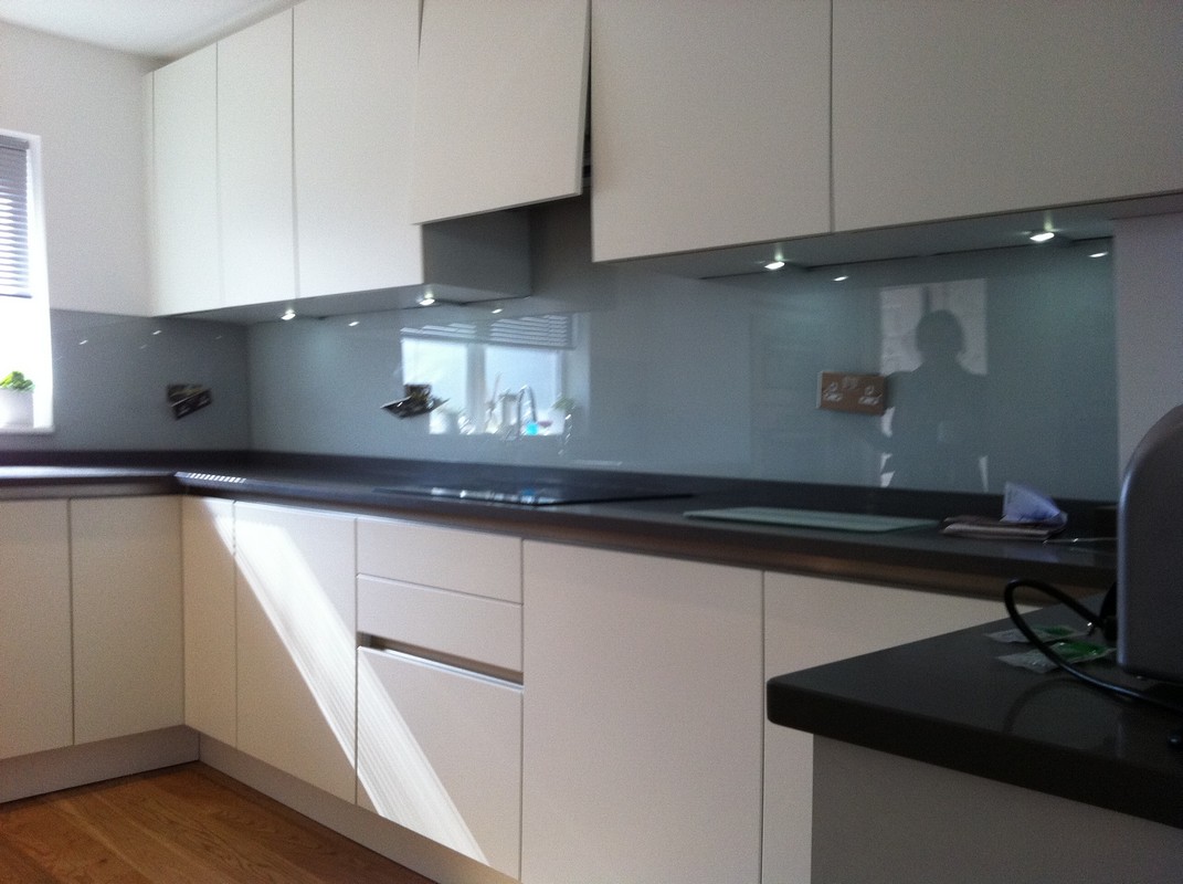 Grey glass kitchen splashback with LED lighting in Radlett