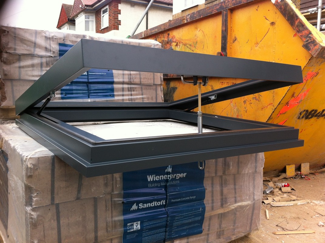Opening flat roof skylight in anthracite grey installed in Radlett
