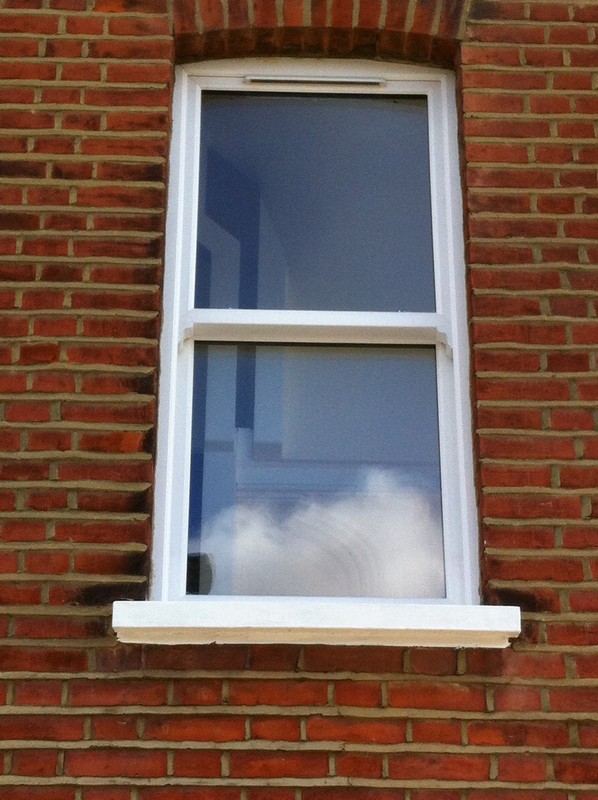 uPVC sash window on Victorian red brick house in Radlett